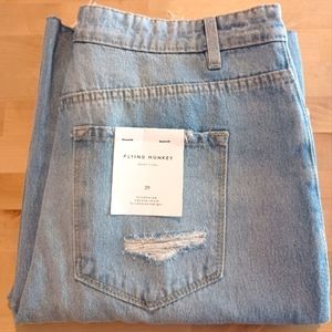Flying Monkey light wash, high waisted, wide legged jeans with heavy distressing